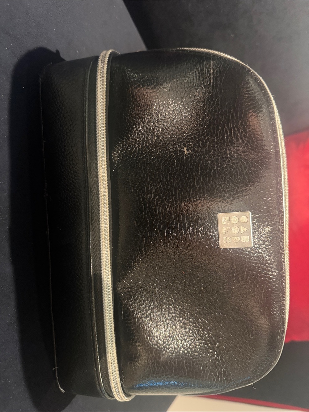 Black makeup bag with silver zipper